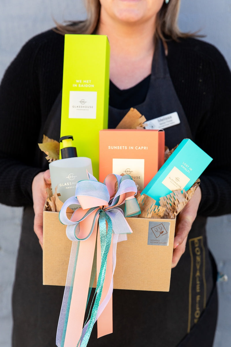 Image of a Donvale Flower Gallery team member holding the Glasshouse Gift Set.