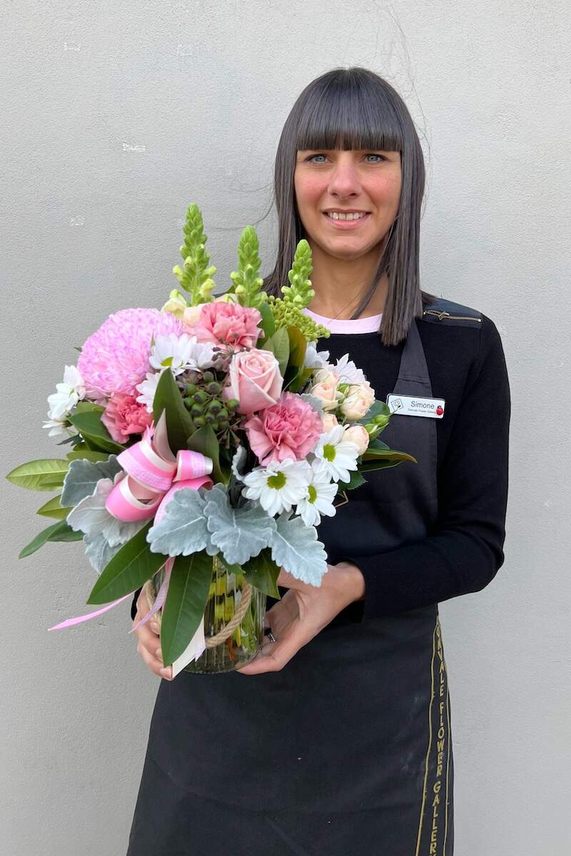 Image of a Donvale Flower Gallery team member holding the Claudia flower bouquet.