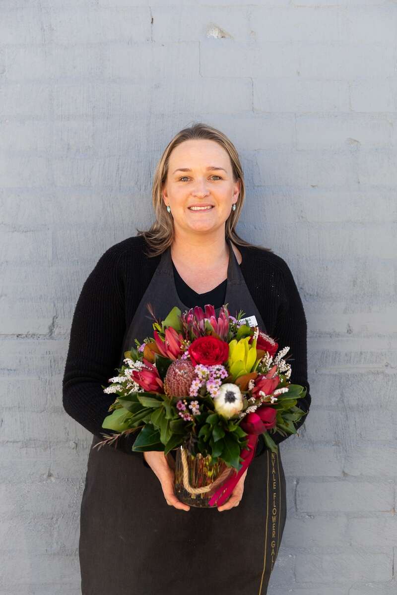 Image of a Donvale Flower Gallery team member holding the Melissa flower bouquet.